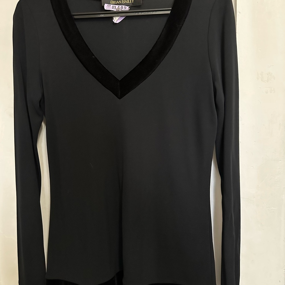 High quality material with velvet. Never worn. Was dry cleaned once.